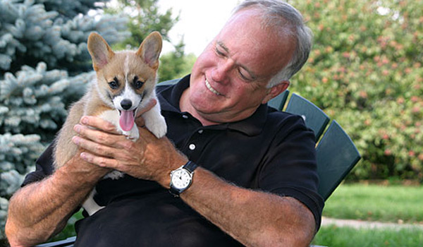 Ed Frawley with a corgi puppy